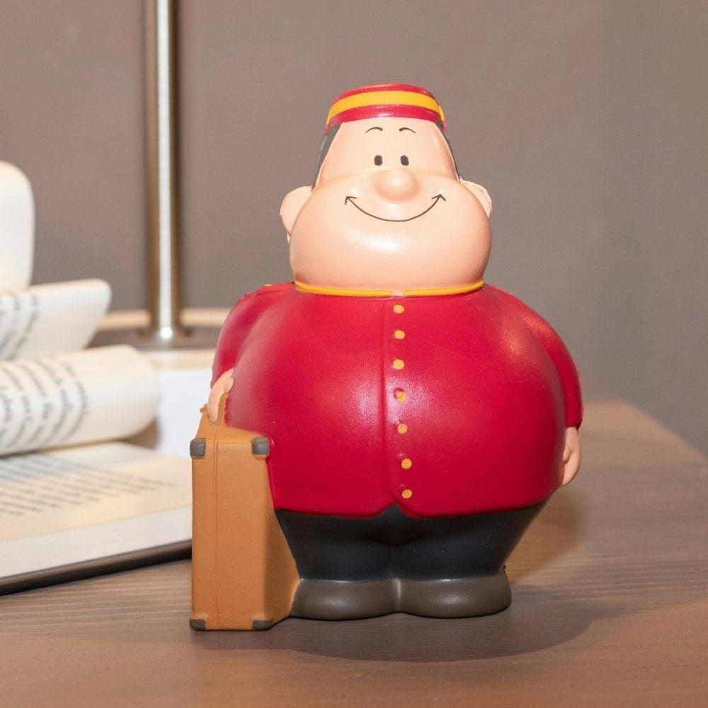 Product image Page Bert in roter Pagenuniform mit Käppi und Koffer – Anti-Stress-Figur zum Bedrucken für Hotels