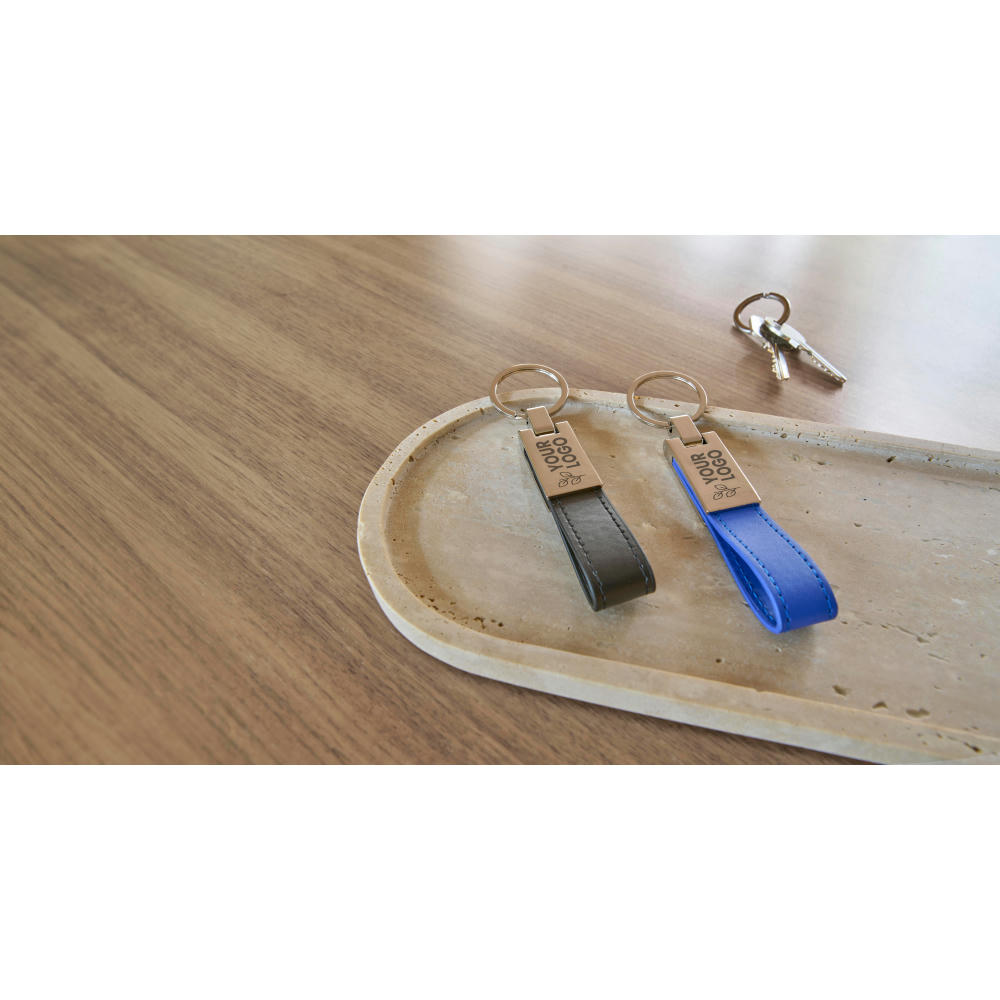 Schlüsselanhänger mit Stahlplatte und Kunsstofflasche Keon Werbeartikel